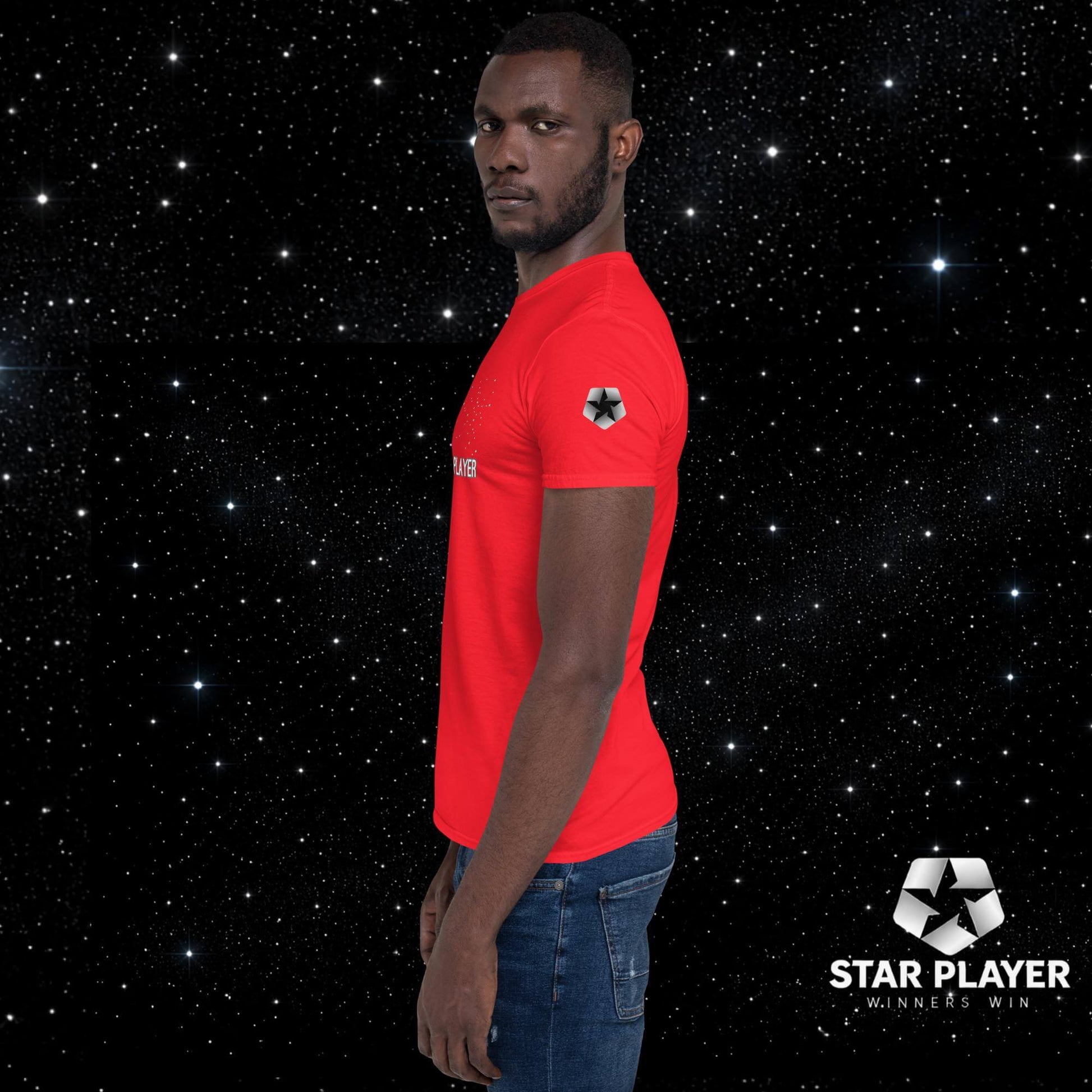 Model wearing the StarPlayer Space Tee in red, showcasing the soft 100% ring-spun cotton cloth against a starry background.